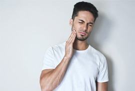 young man with toothache